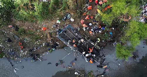 Bus plunges off a Guatemala bridge, killing at least 51 passengers