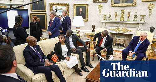 Donald Trump ambushes South Africa's president with video falsely claiming white genocide – video